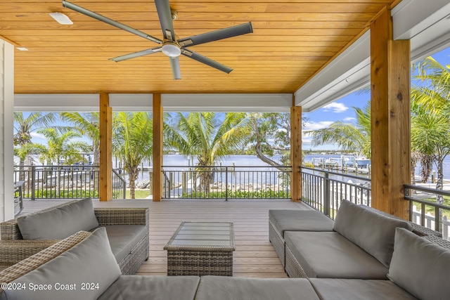 19 Vip Is Unit A, Grant, FL 32949 - deck featuring a water view, outdoor lounge area, and a ceiling fan