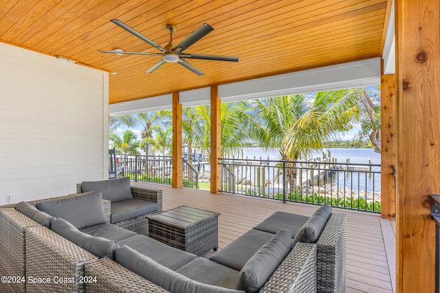 view of patio featuring a water view, an outdoor living space, and ceiling fan