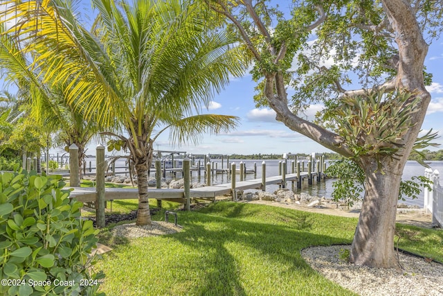 19 Vip Is Unit A, Grant, FL 32949 - view of grassy yard featuring a dock and a water view