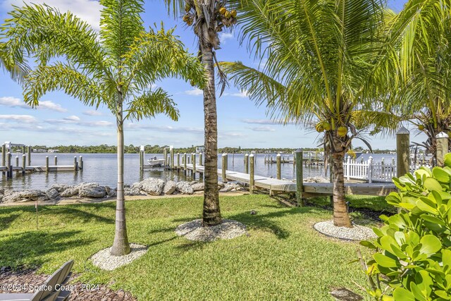 19 Vip Is Unit A, Grant, FL 32949 - view of green lawn with a dock and a water view