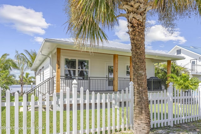 19 Vip Is Unit A, Grant, FL 32949 - bungalow with a porch and metal roof