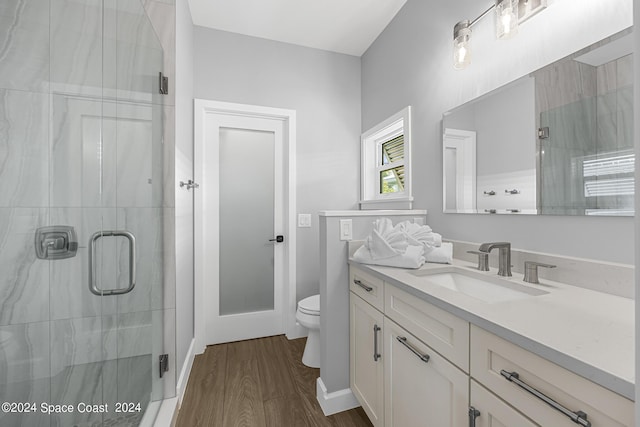 19 Vip Is Unit A, Grant, FL 32949 - full bath with toilet, vanity, wood finished floors, and a shower stall