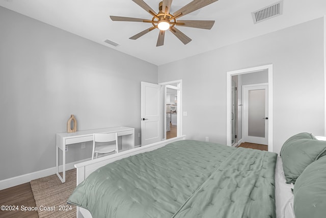 bedroom with wood-type flooring and ceiling fan