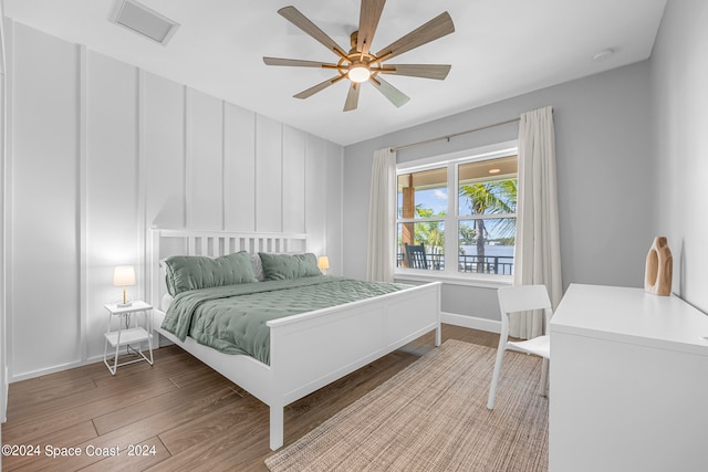 bedroom with light hardwood / wood-style floors and ceiling fan