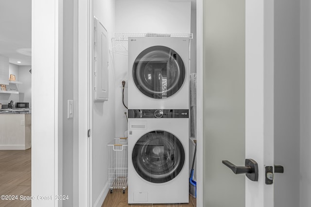 19 Vip Is Unit A, Grant, FL 32949 - laundry room with stacked washer / dryer, wood finished floors, and baseboards
