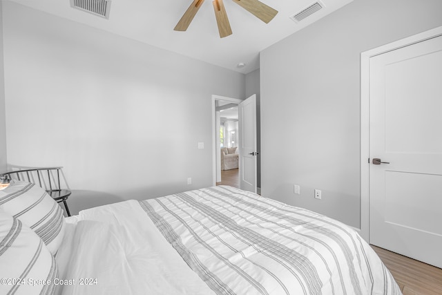 bedroom featuring hardwood / wood-style floors and ceiling fan