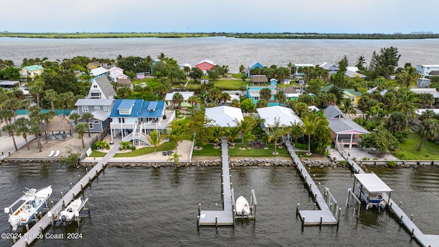 birds eye view of property with a water view