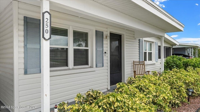 entrance to property featuring covered porch