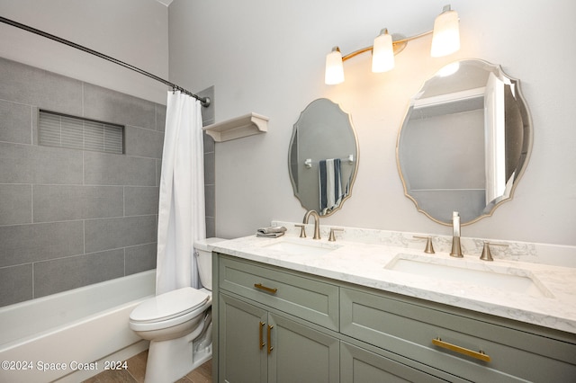 full bathroom featuring shower / tub combo with curtain, vanity, and toilet