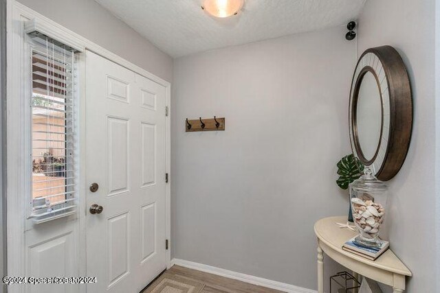 foyer featuring a textured ceiling