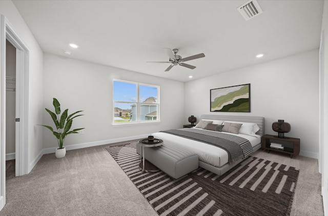 carpeted bedroom with ceiling fan