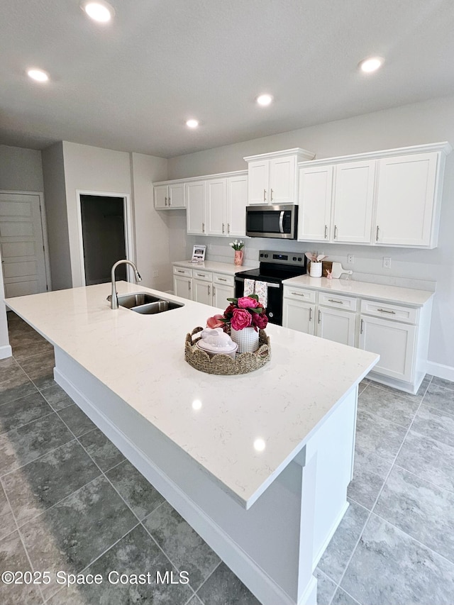 kitchen with black / electric stove, a spacious island, recessed lighting, white cabinetry, and stainless steel microwave