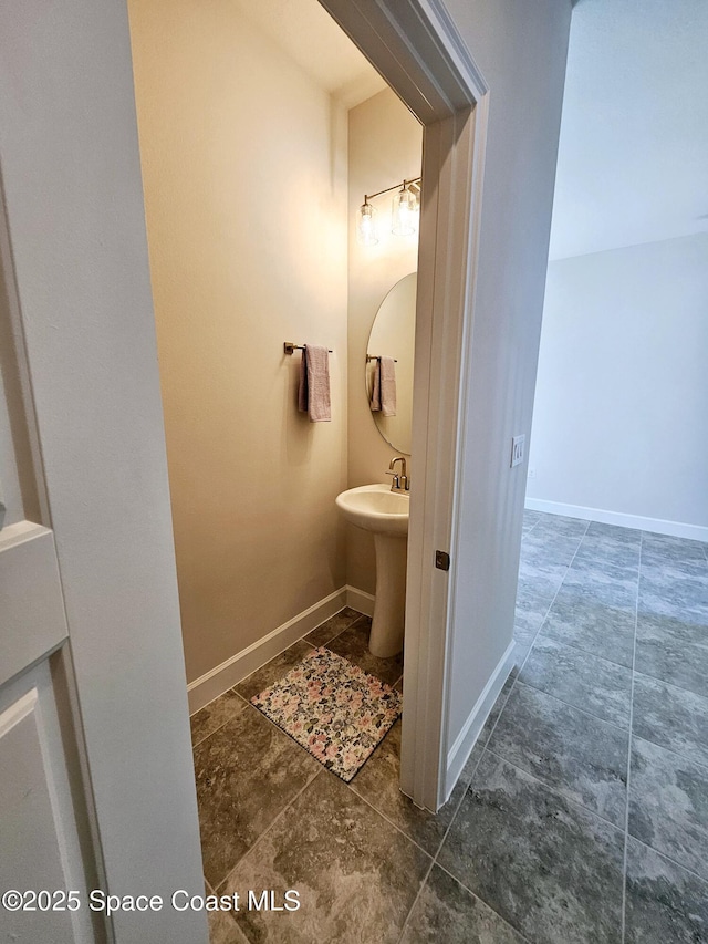 bathroom featuring baseboards