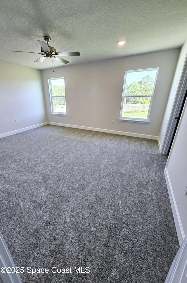 carpeted spare room featuring recessed lighting, a textured ceiling, baseboards, and a ceiling fan