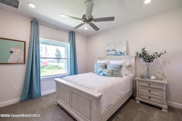 bedroom featuring dark carpet and ceiling fan