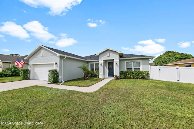 ranch-style home with a garage and a front yard