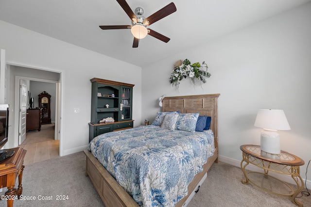 bedroom featuring ceiling fan and light colored carpet