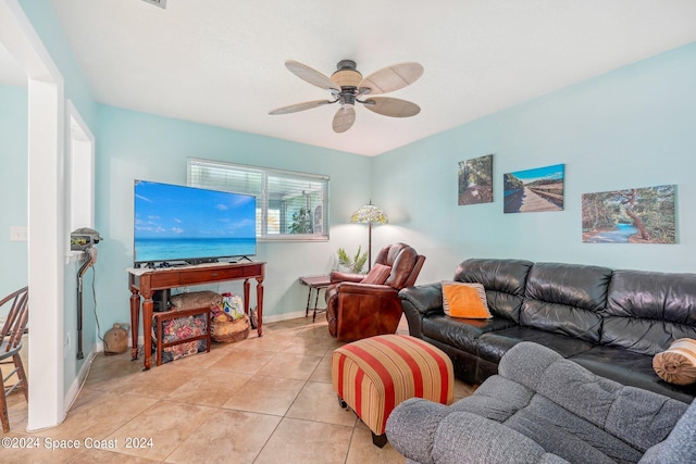 tiled living room with ceiling fan