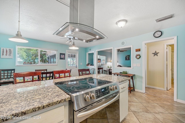 kitchen with electric stove, light stone counters, a textured ceiling, and island exhaust hood