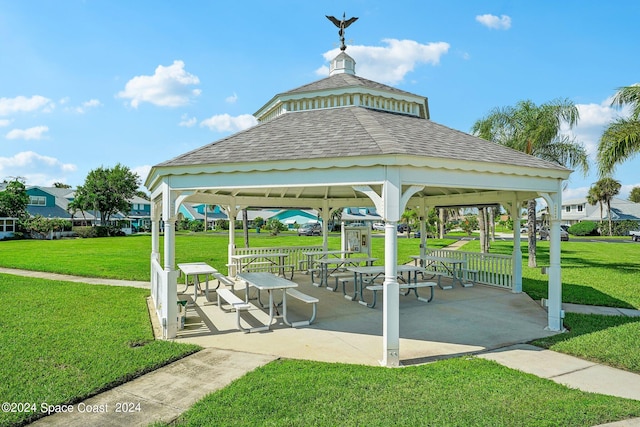 surrounding community featuring a gazebo and a lawn