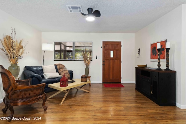 interior space with dark hardwood / wood-style flooring and a textured ceiling