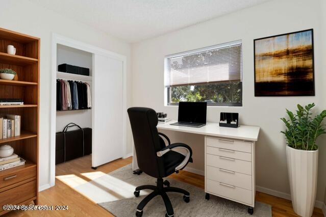 office with light hardwood / wood-style floors