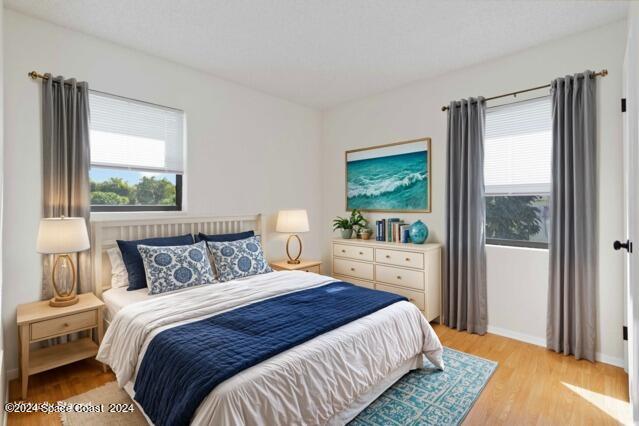 bedroom with light wood-type flooring