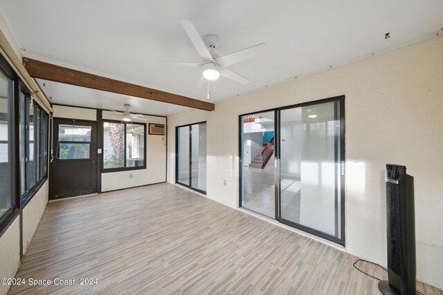 unfurnished room featuring light wood-type flooring and ceiling fan