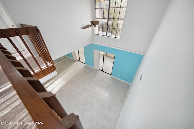 entryway featuring a high ceiling and ceiling fan