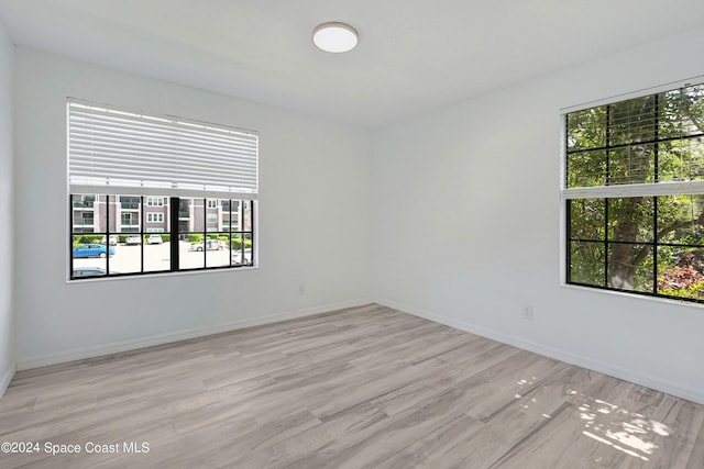 spare room with light wood-type flooring