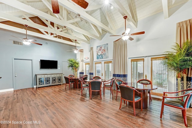 dining room with french doors, beamed ceiling, wooden ceiling, hardwood / wood-style floors, and high vaulted ceiling