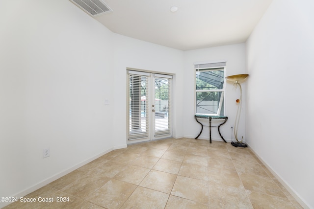 empty room with light tile patterned floors