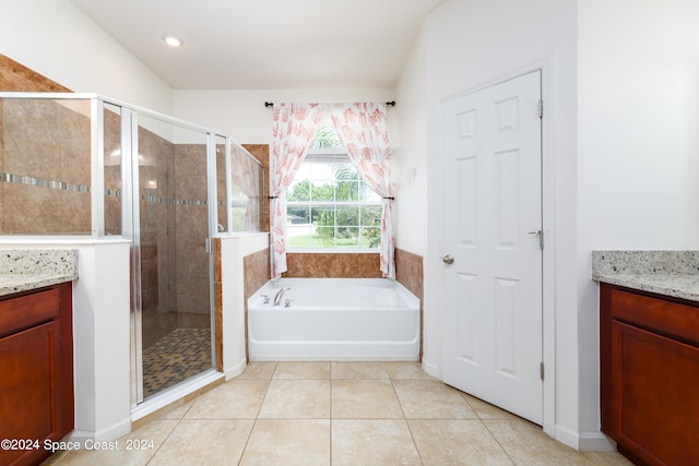 bathroom with vanity, plus walk in shower, and tile patterned floors