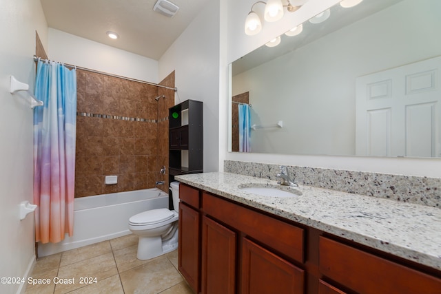 full bathroom featuring vanity, shower / bath combo with shower curtain, toilet, and tile patterned floors