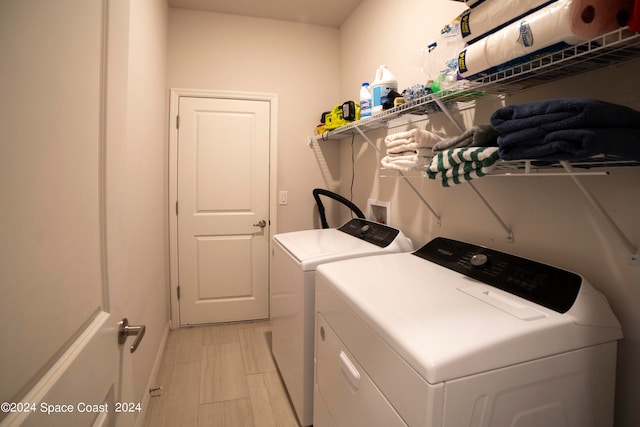 washroom featuring washing machine and dryer