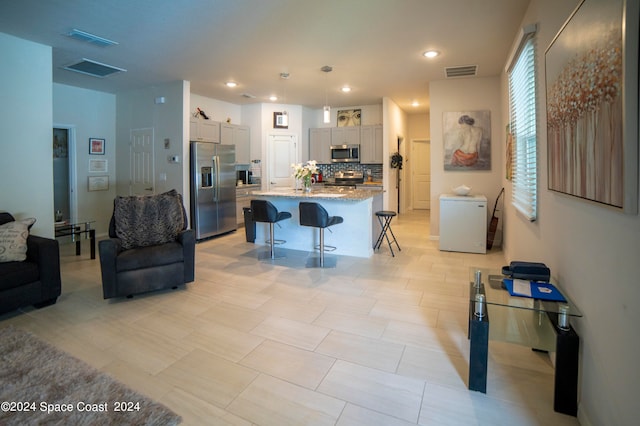 living room with light tile patterned floors