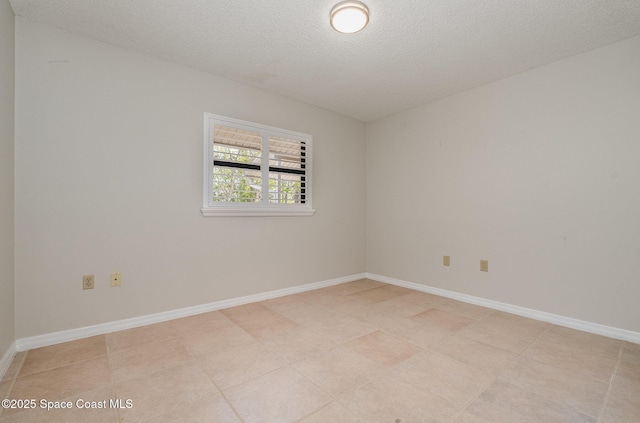 empty room with a textured ceiling