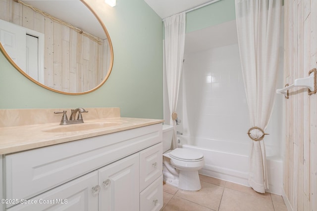 full bathroom with shower / bath combo, vanity, tile patterned floors, and toilet