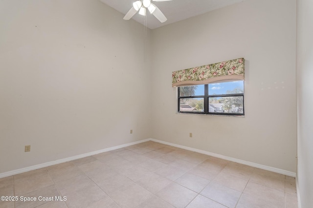 empty room featuring light tile patterned flooring, ceiling fan, and high vaulted ceiling