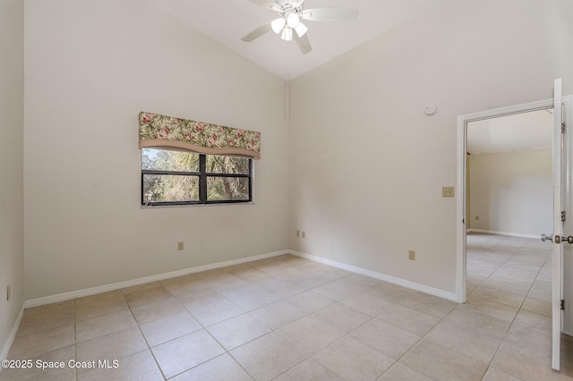 tiled empty room with high vaulted ceiling and ceiling fan