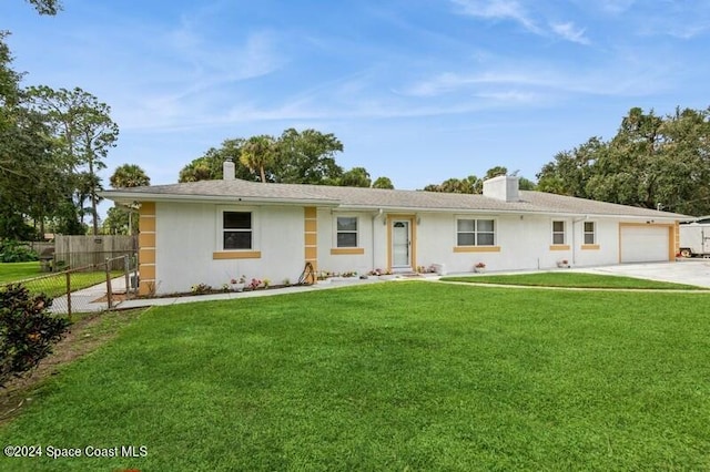 single story home with a front yard and a garage