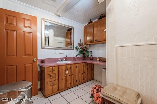 bathroom featuring vanity, ornamental molding, tile walls, and tile patterned flooring