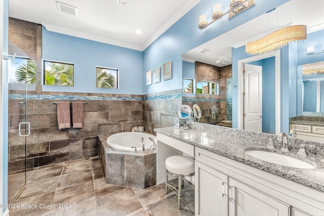 bathroom with vanity, separate shower and tub, and crown molding