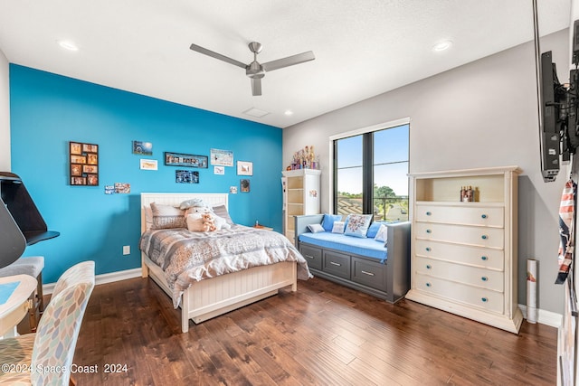 bedroom featuring ceiling fan and dark hardwood / wood-style flooring