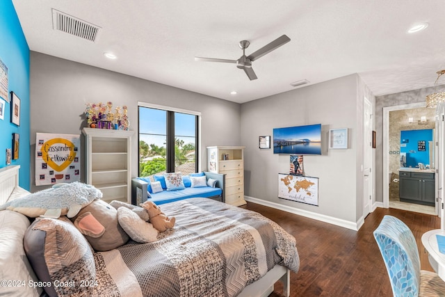 bedroom with ceiling fan, dark hardwood / wood-style flooring, a textured ceiling, and connected bathroom