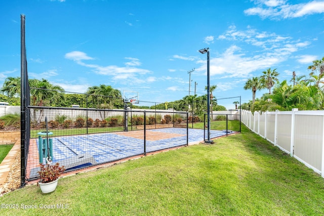 view of basketball court featuring a lawn