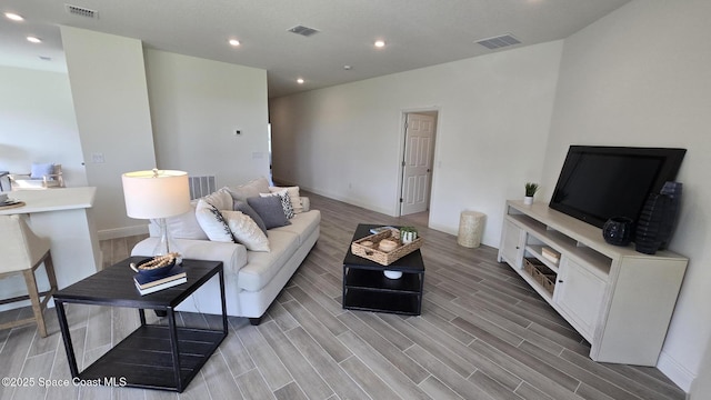 4346 Kelsey Ln, Sebastian, FL 32976 - living room featuring light wood finished floors and recessed lighting