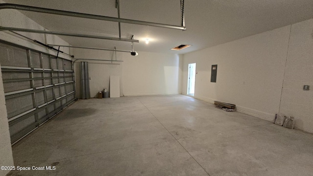 4346 Kelsey Ln, Sebastian, FL 32976 - garage with a garage door opener and electric panel
