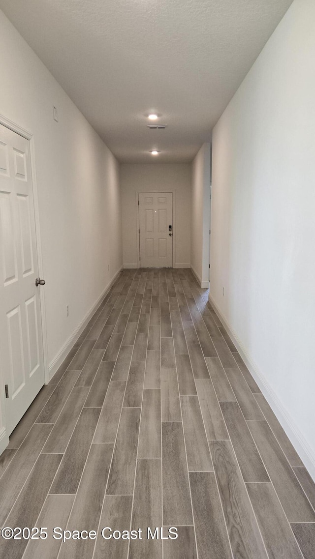 4346 Kelsey Ln, Sebastian, FL 32976 - empty room with wood finished floors and a textured ceiling