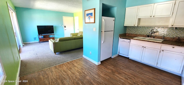 kitchen featuring white cabinets, white appliances, dark hardwood / wood-style floors, and sink